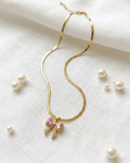 Luminous Gilded Bow Pendant